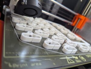 3D printed cable spine organizer mounted in Cooler Master NR200 case