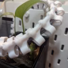 3D printed cable spine organizer mounted in Cooler Master NR200 case