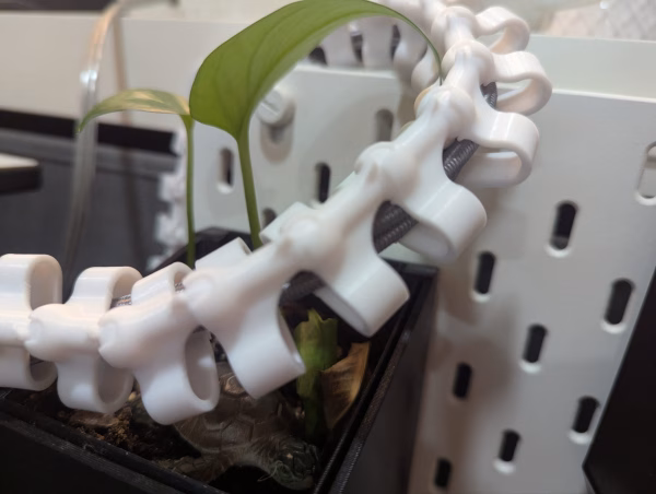 3D printed cable spine organizer mounted in Cooler Master NR200 case