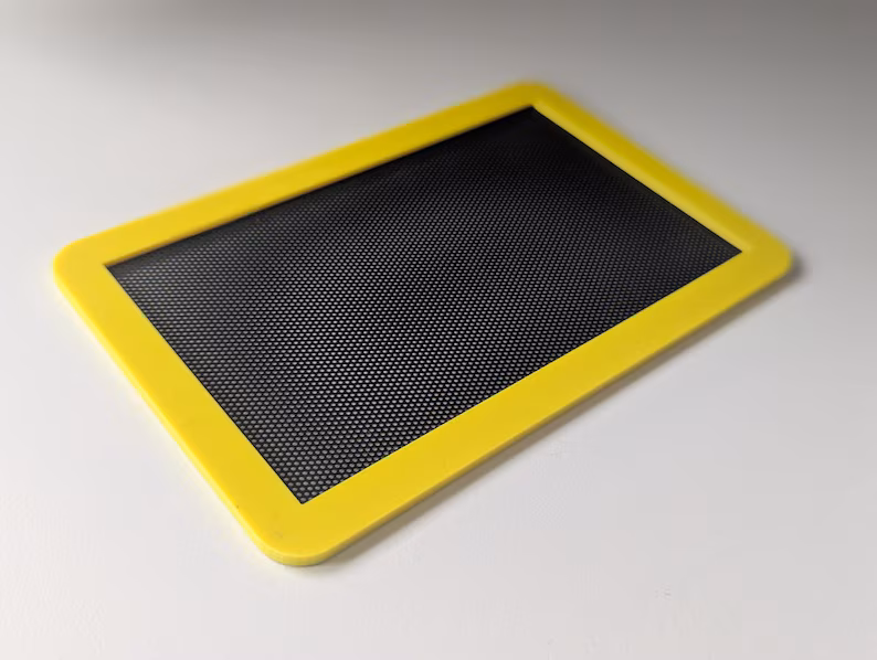 Magnetic dust filter covering ventilation panel on Cooler Master NR200 case