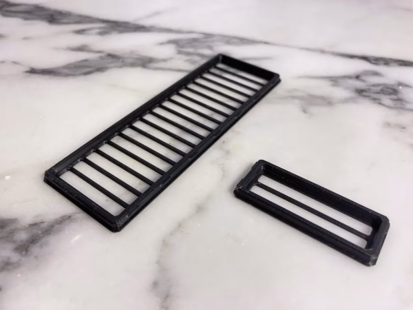 3D printed snap-fit PCIe slot covers installed in unused vertical GPU slots of NR200